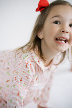 Girl wearing her Christmas pjs