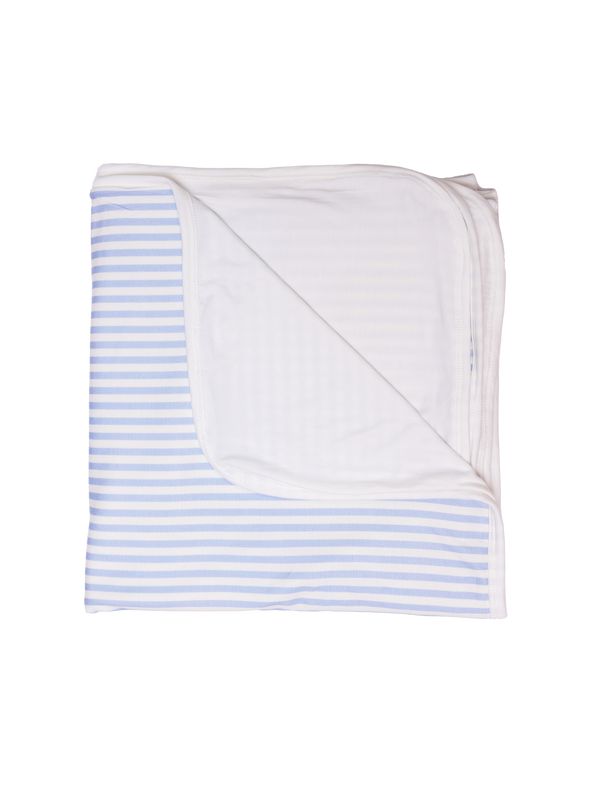 A folded striped blue blanket arranged with the striped patterns visible.