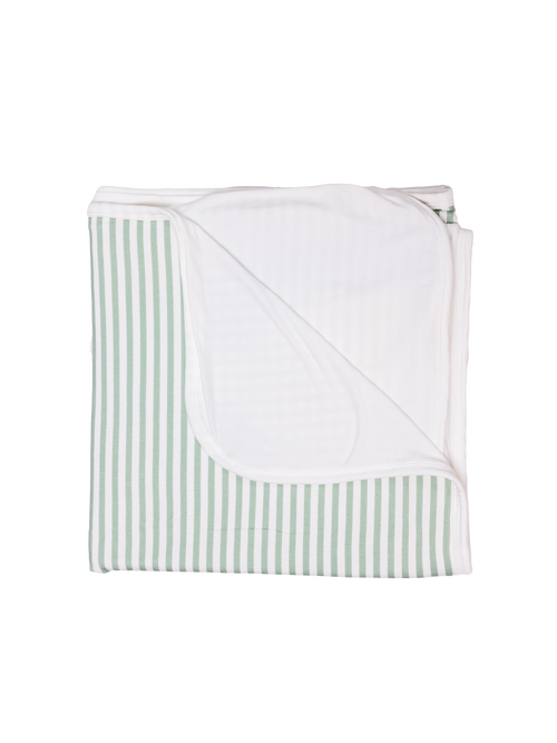 A folded striped green blanket arranged with the striped patterns visible.