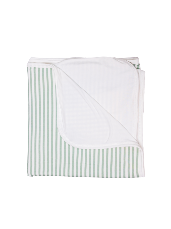 A folded striped green blanket arranged with the striped patterns visible.