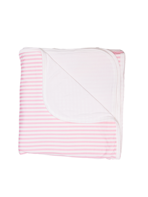 A folded striped pink blanket arranged with the striped patterns visible.