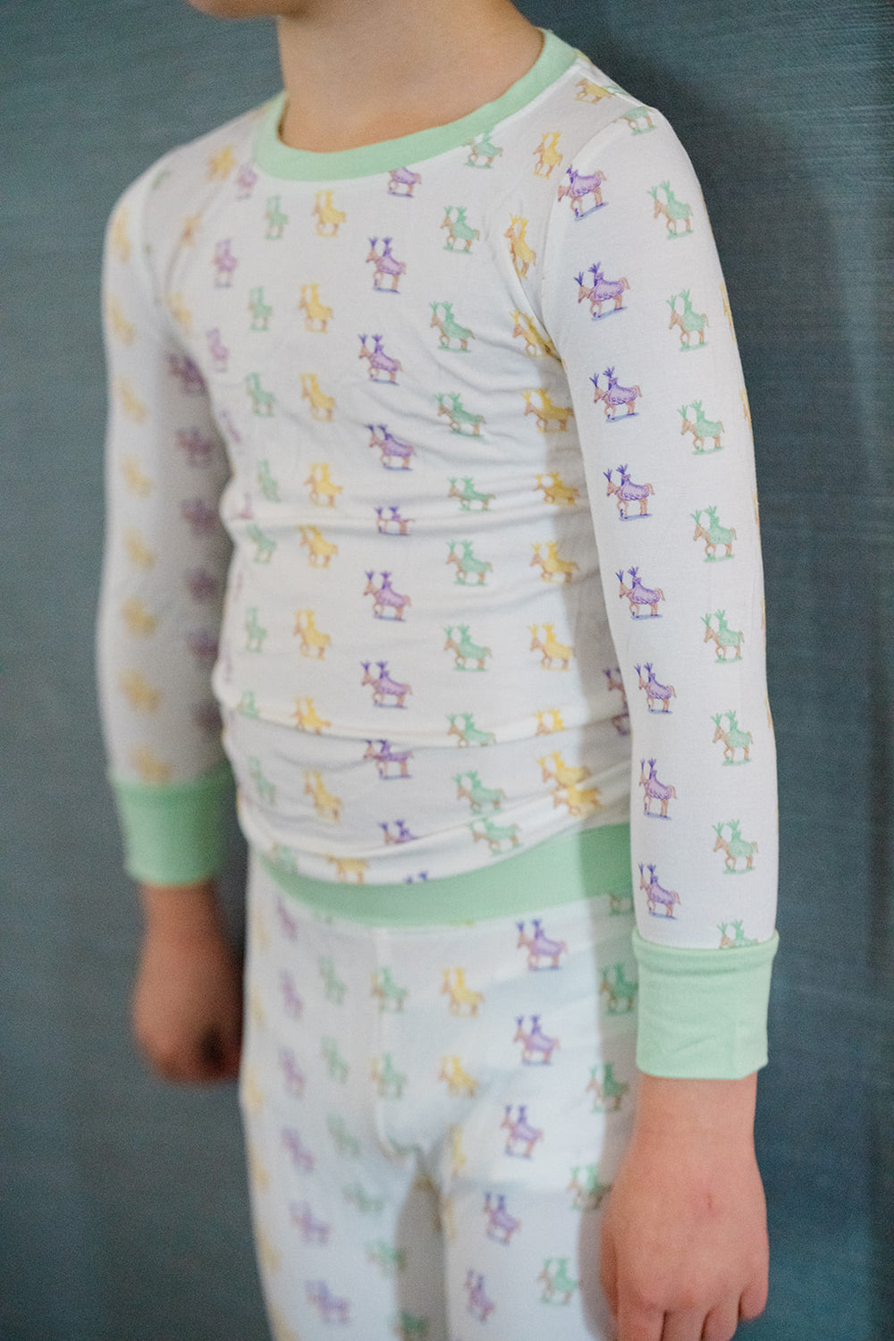 Children's pajama set with frog pattern on a white background