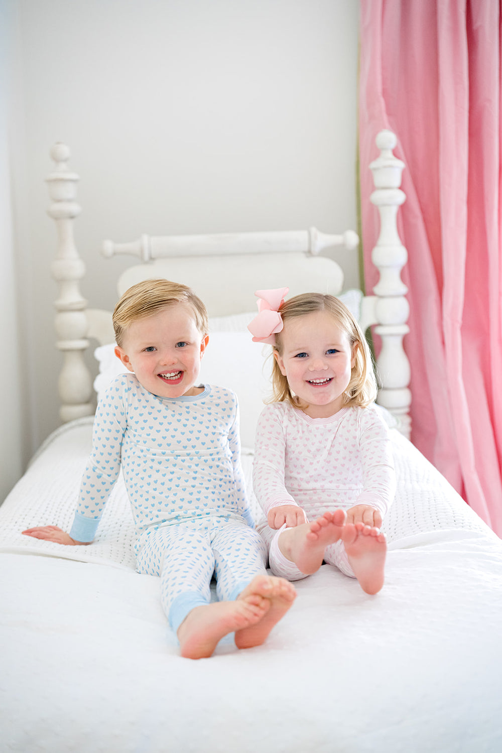 Children's pajama set with light blue heart pattern on a white background