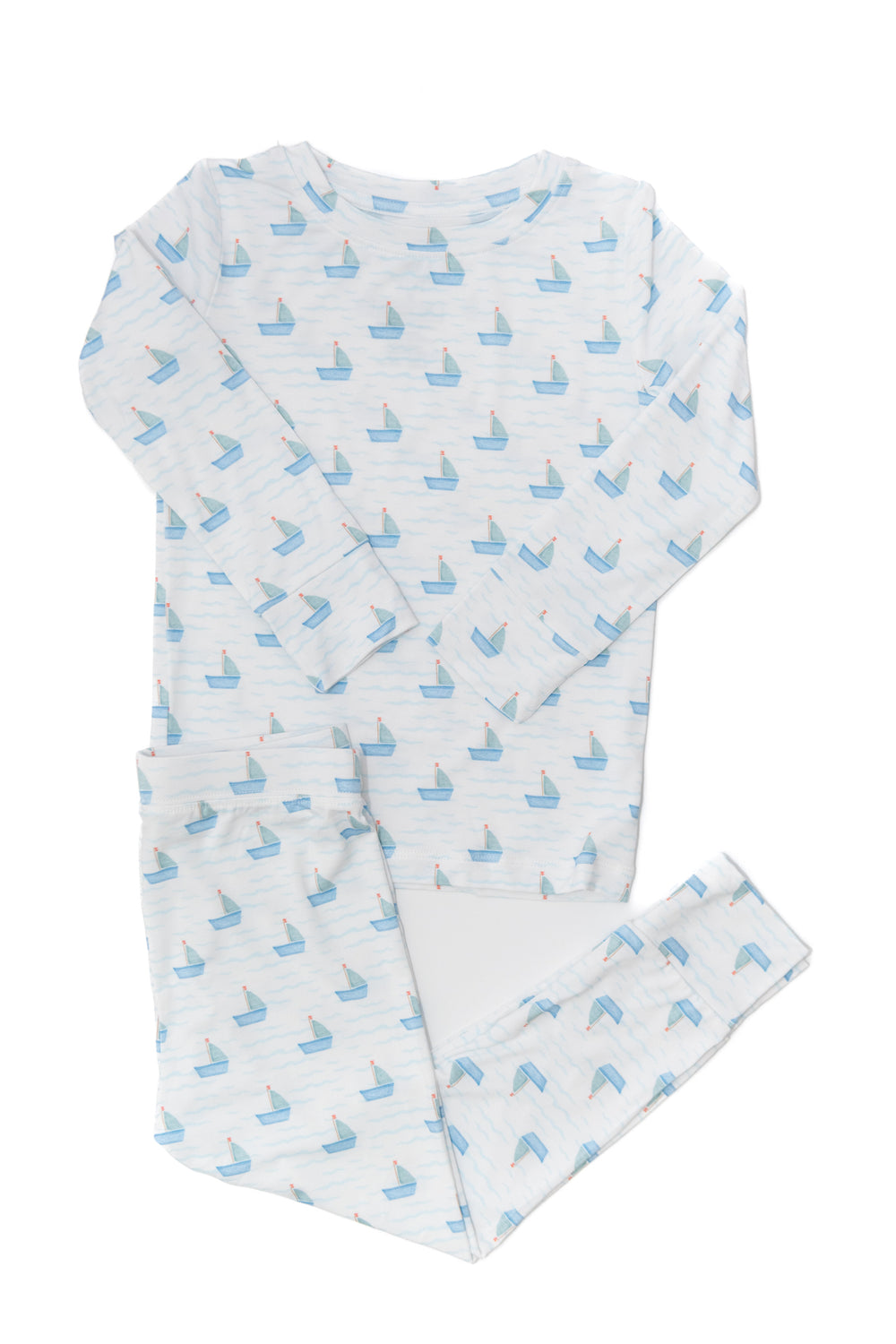 Baby outfit with blue boat pattern on a white background