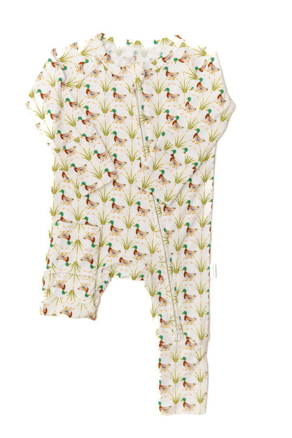 Baby onesie with duck and grass pattern on a white background