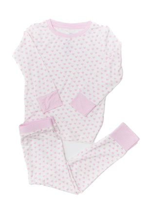 Pink and white polka dot baby outfit on a white background