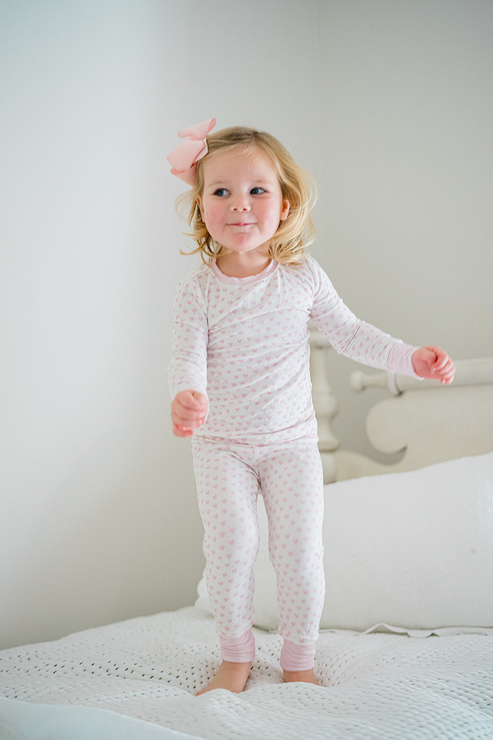 Baby onesie with blue and white pattern on a white background