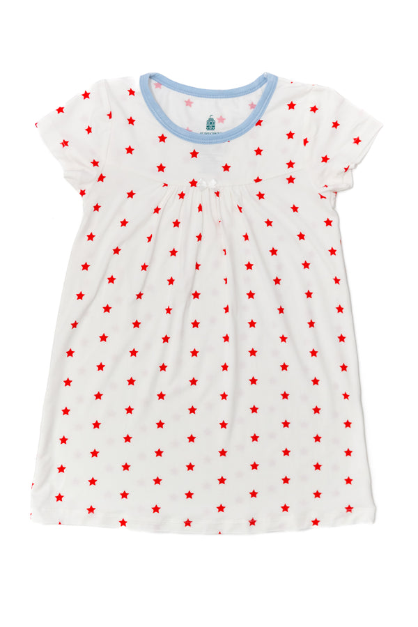 White dress with red star pattern on a white background